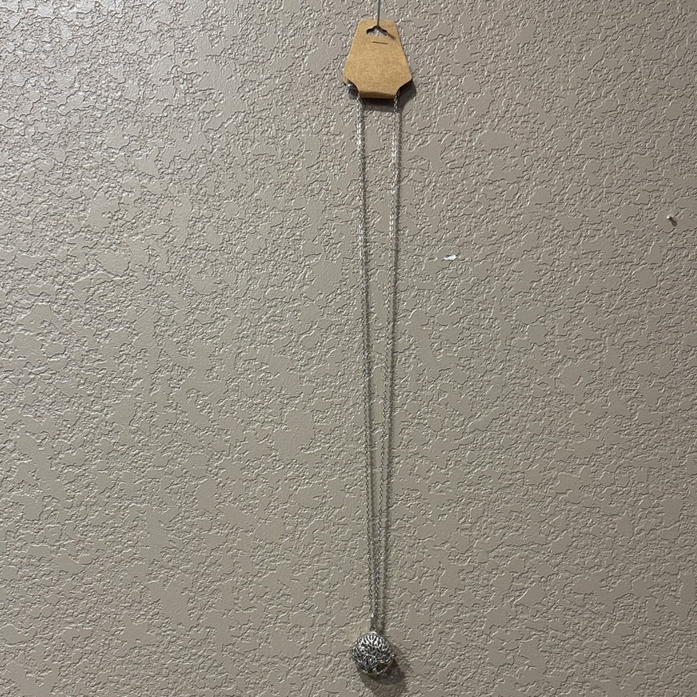 Silver family tree pendant that opens